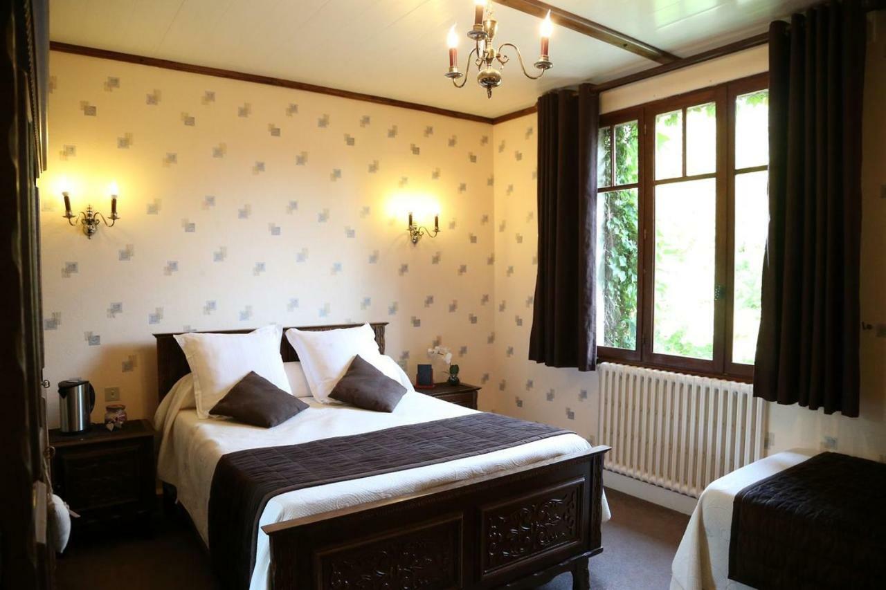 Dreibettzimmer mit Gartenblick